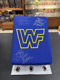 AUTOGRAPHED WWF Replica Turnbuckle Pad signed by Bret Hart, Mike Chioda and Jimmy Korderas